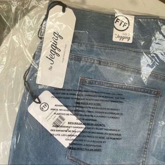 Medium Wash High Rise Destructed Jeggings Short Inseam | Fashion To Figure - Picture 6 of 7